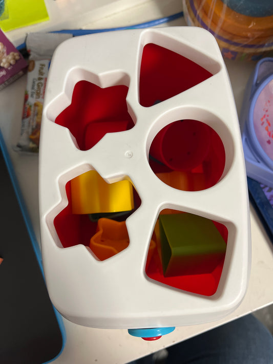 red/white Fisher Price Sorting Blocks