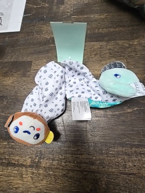 white/green Infantino Foot Rattles