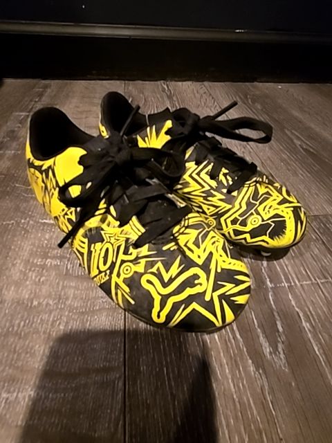 Yellow/black Puma Soccer cleats, 10