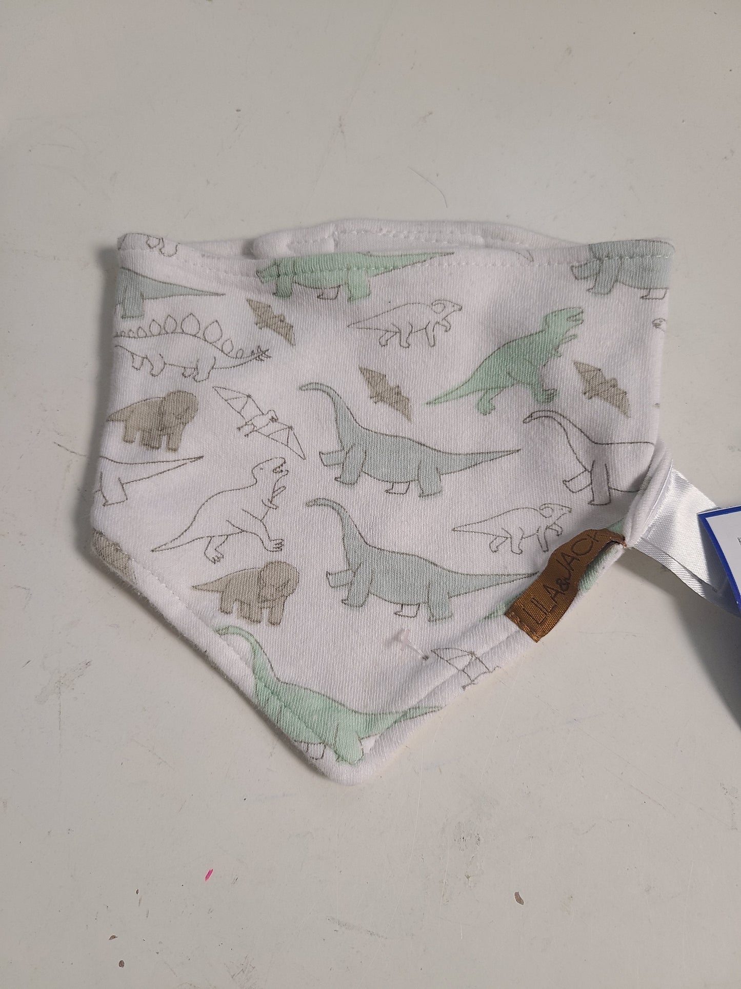 green/brown Lila & Jack Dinosaur Bib