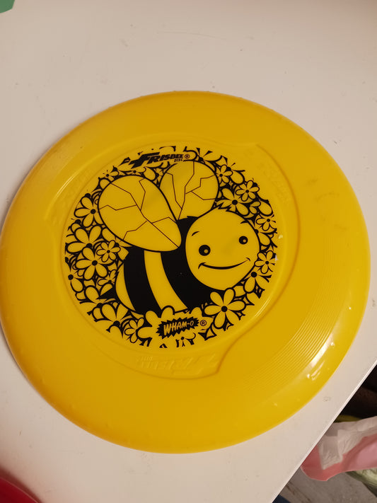yellow Wham-o Bee Frisbee