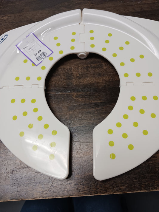 white Graco Travel Potty Seat