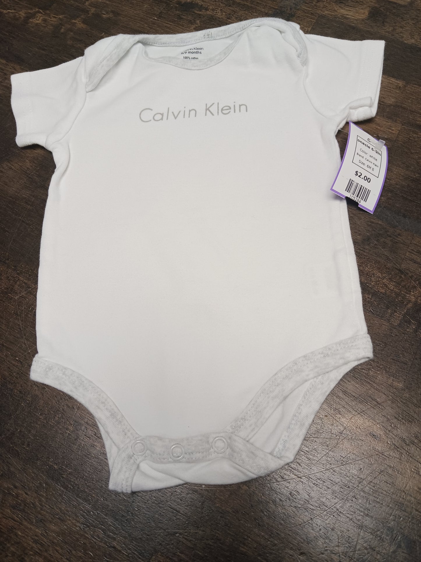white Calvin Klein onesie 6-9m, 6M B
